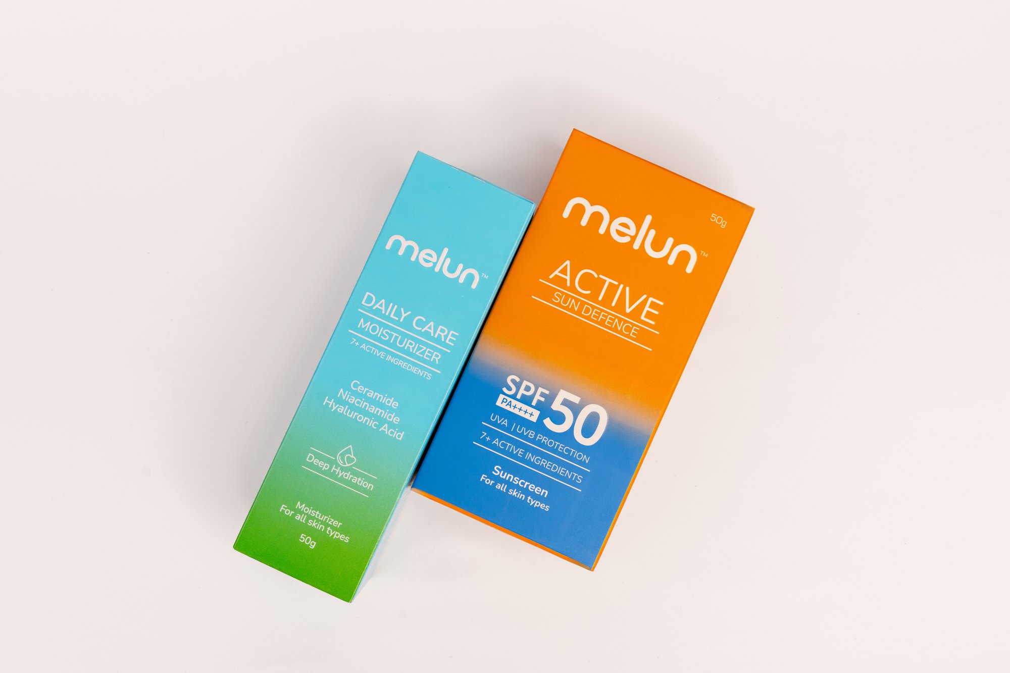 Side-by-side moisturizer with sunscreen boxes in Mumbai product shoot